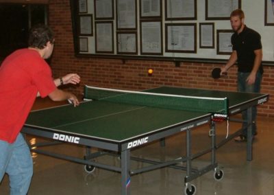 Two guys playing ping pong