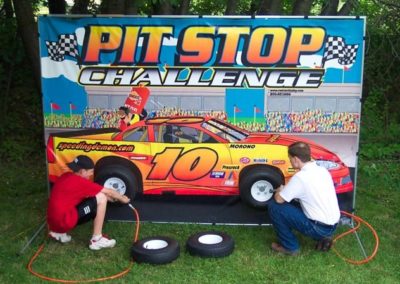 Two players compete against each other to see who can change the tires the fastest.
