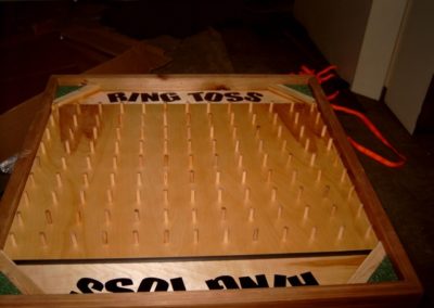 Table top ring toss with legs. Toss rings on posts, one on wins. Great for kids and adults.