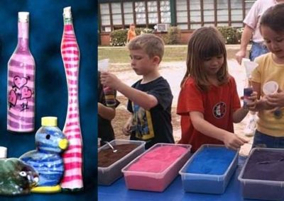 Kids getting ready to fill bottles with colored, decorative sand
